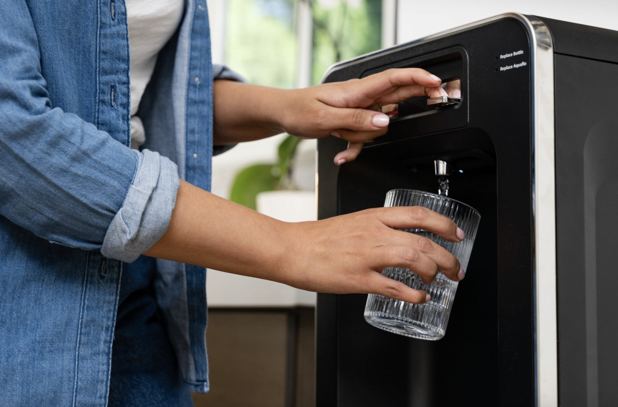 how to stay hydrated at work getting glass of water
